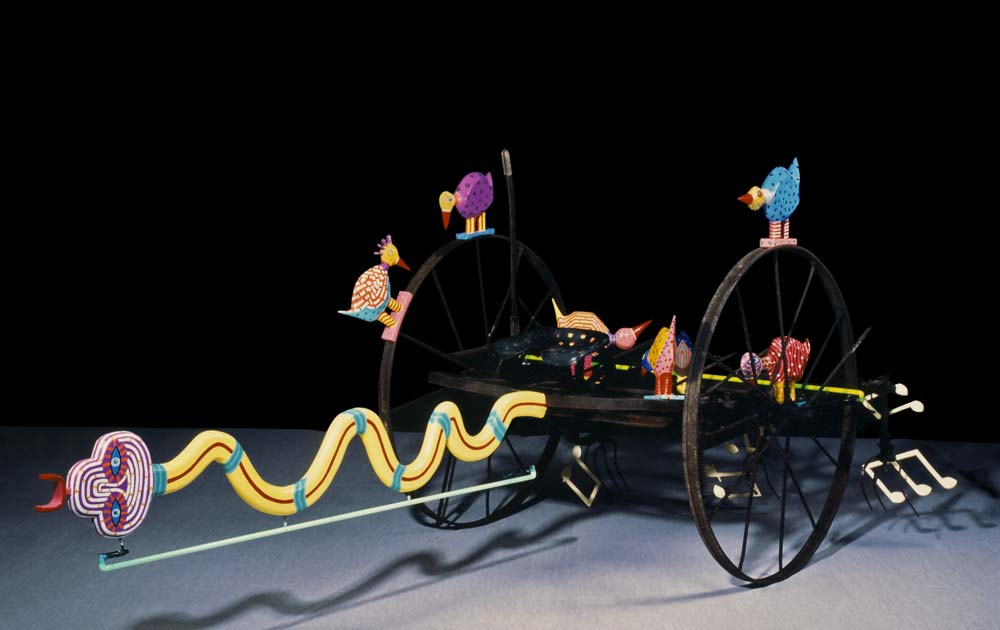 a haytedder , a snake, birds and note's with neonlight"